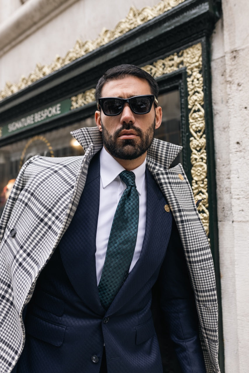 model wearing bespoke suit and overcoat editorial tailoring look