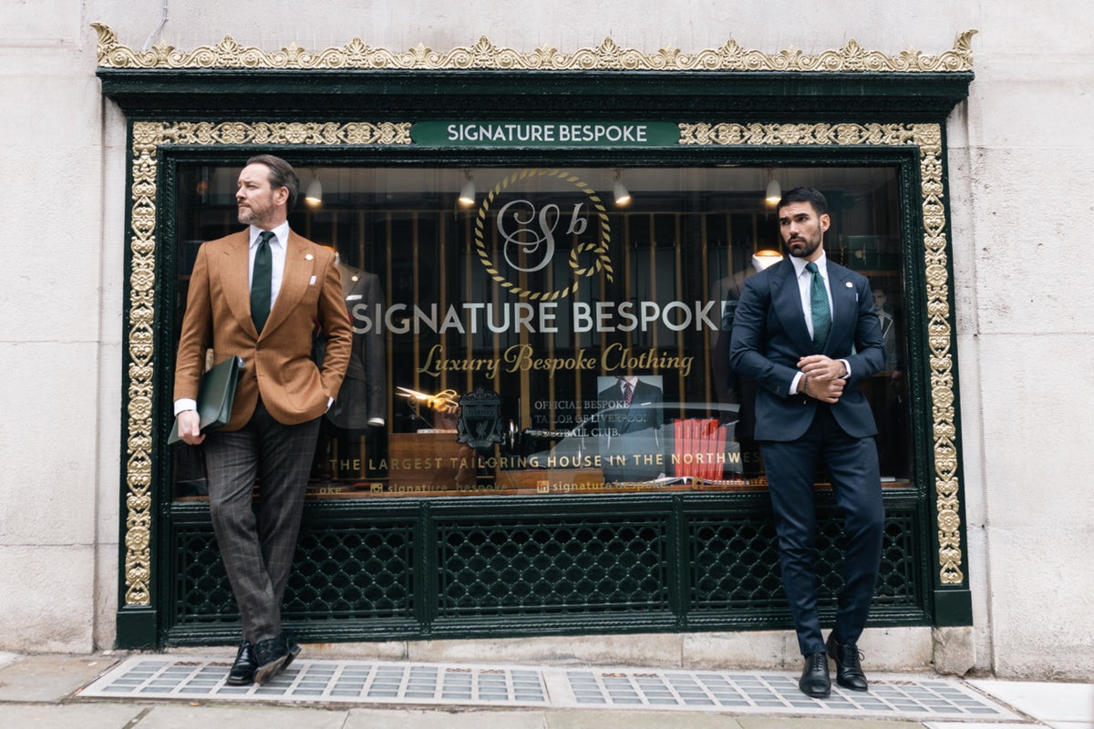 navy bespoke suit and brown bespoke suit